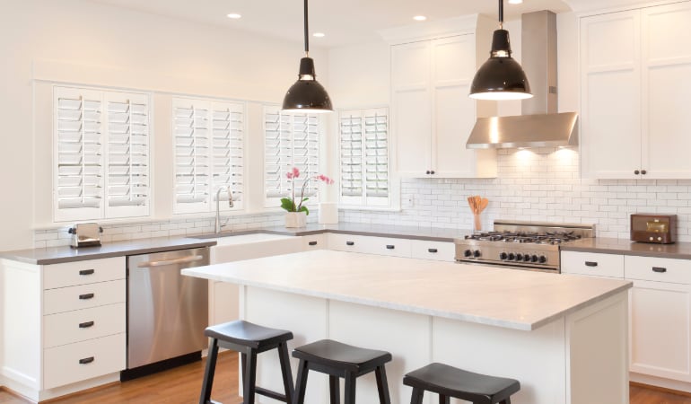 Plantation shutters in a bright Destin kitchen.